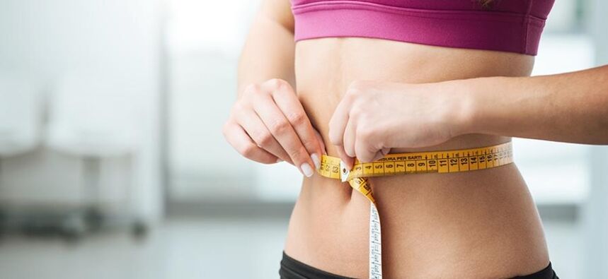 Girl measures waist size